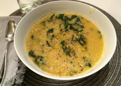 red lentil soup with greens and lemon